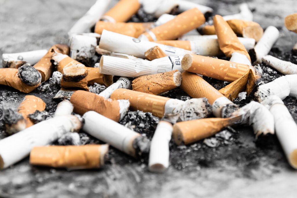 Destructive invention - cigarette butts in a pile